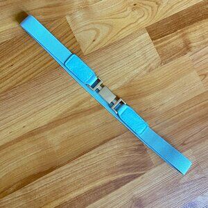 Light blue elastic stretch belt with gold-tone interlocking buckle